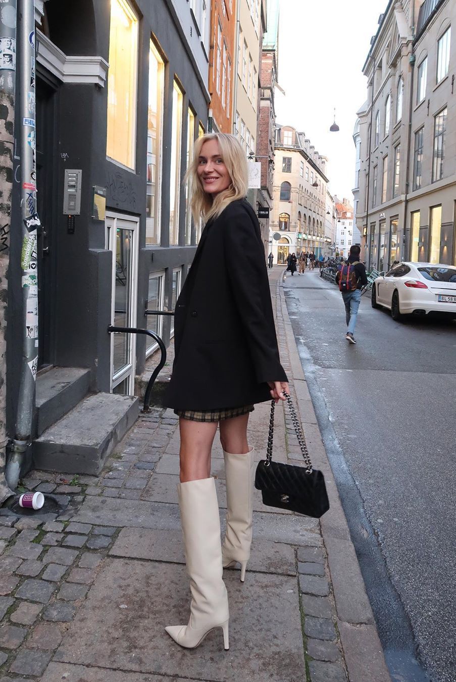 black oversized blazer, white boots and plaid dress