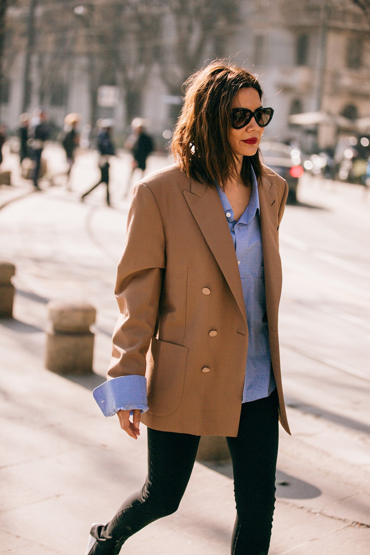 Christine Centenera wearing blue button down shirt with camel blazer