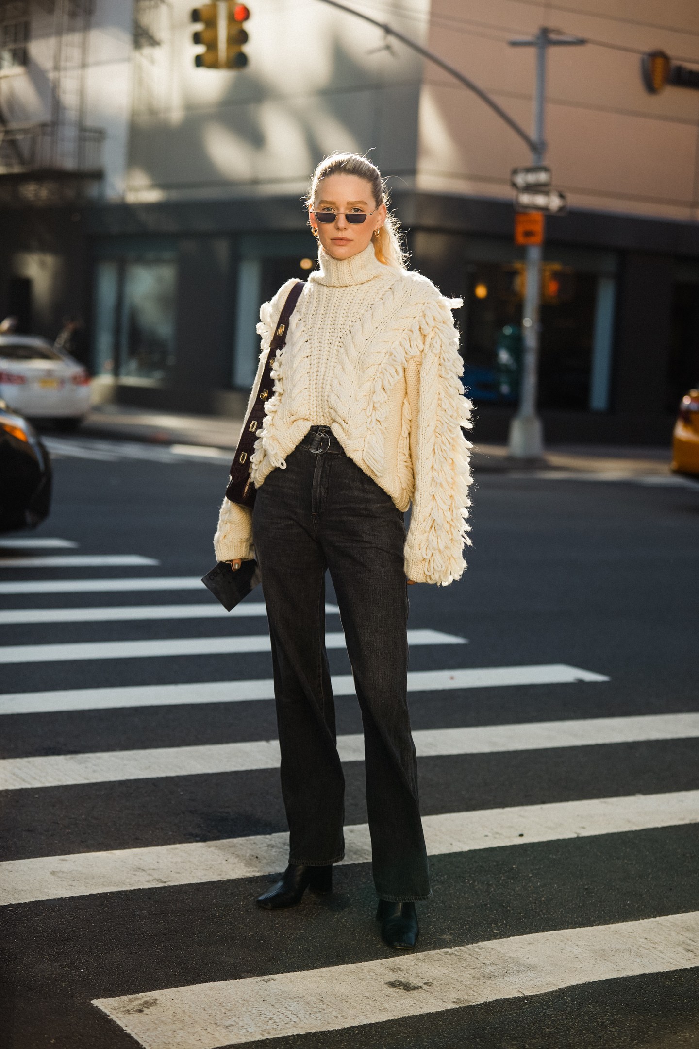 cable-knit sweater with black jeans outfit